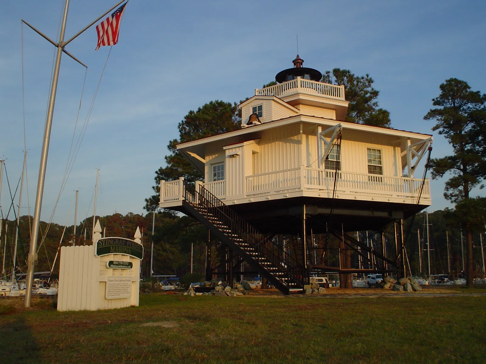 The white Stingray Point lighthouse at Deltaville on a sunny day